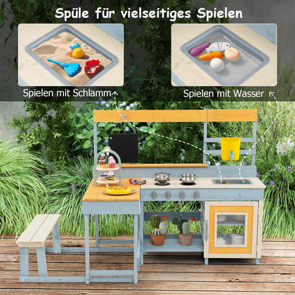 Barnens utomhuslekkök med picknickbord och diskho